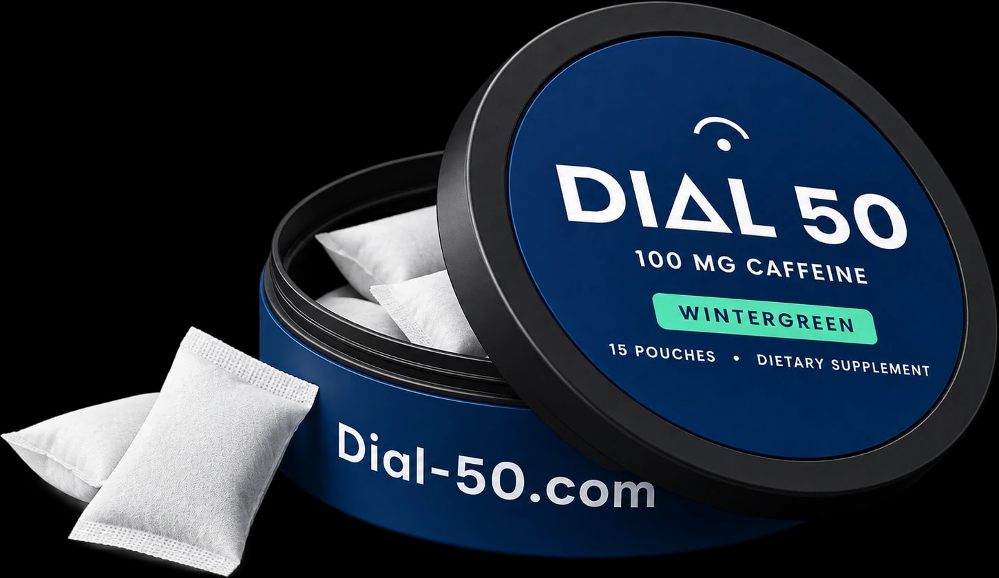 An open can of DIAL 50 Wintergreen caffeine pouches with two pouches spilling out
